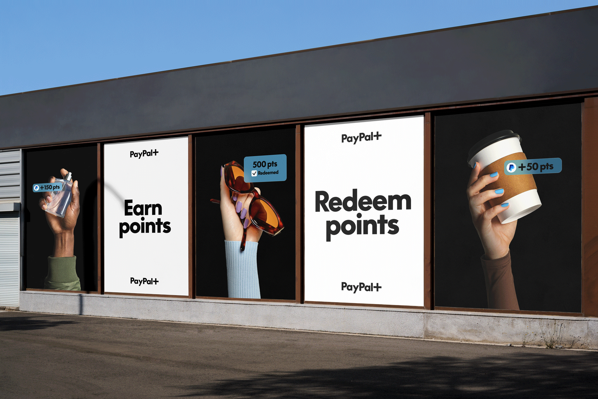 Billboard advertisements promoting earning and redeeming points through PayPal+, featuring images of hands holding different items such as a bottle, sunglasses, and a coffee cup with points earned or redeemed labels.