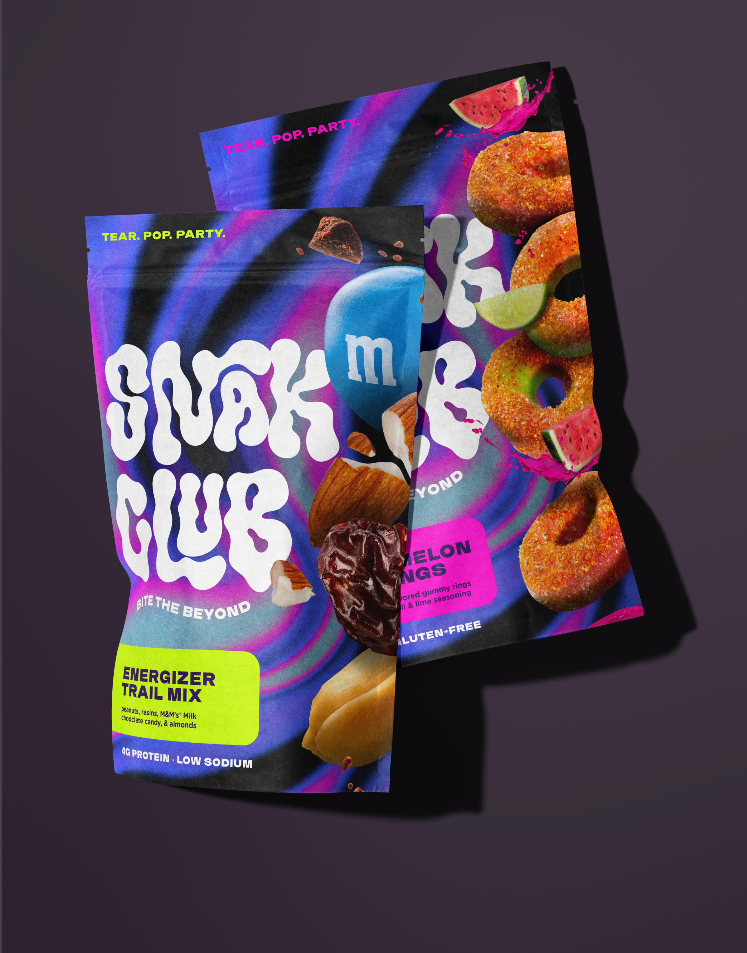 Close-up of colorful snack packaging with vibrant design, images of fruit and snacks, featuring text highlighting flavor and nutritional benefits.