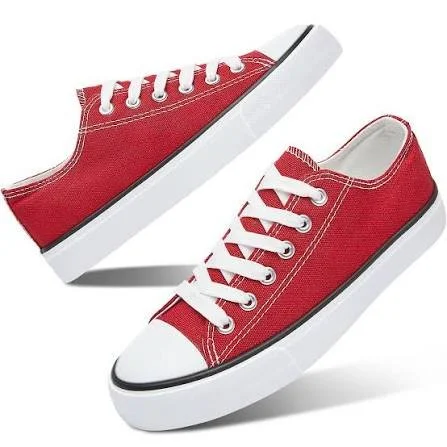 Red canvas sneakers with white laces and white soles.