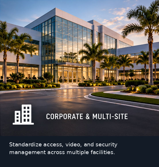 Modern corporate office building with glass facade and landscaped entrance at dusk.