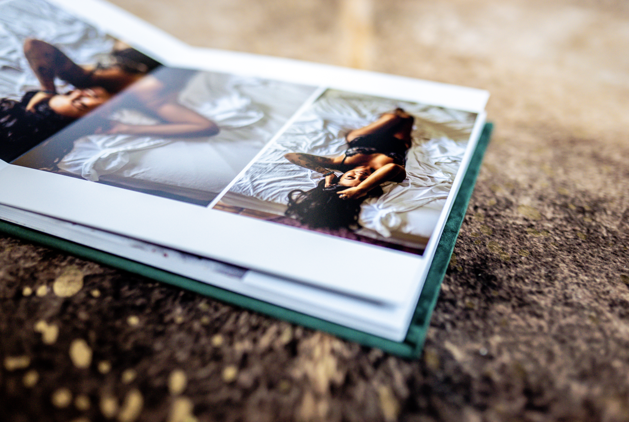 Photo album on stone surface with images of a person lying on a bed.