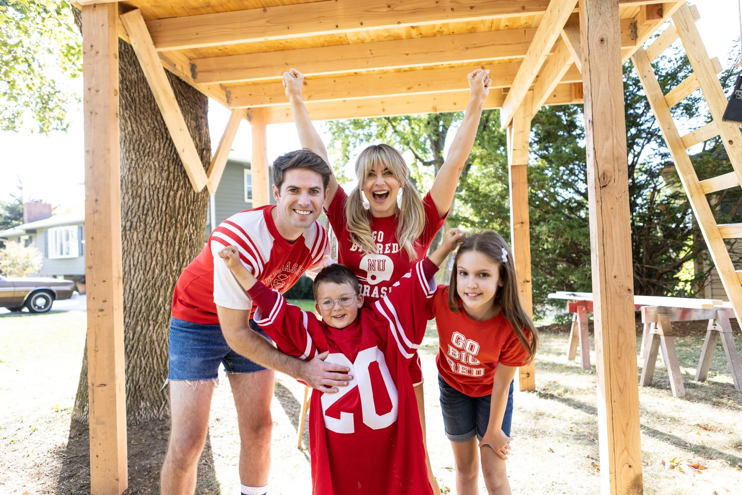 Julianne Hough, starring as Louise Moriarty, shares a moment with her family in a flashback scene from GOING FOR TWO.