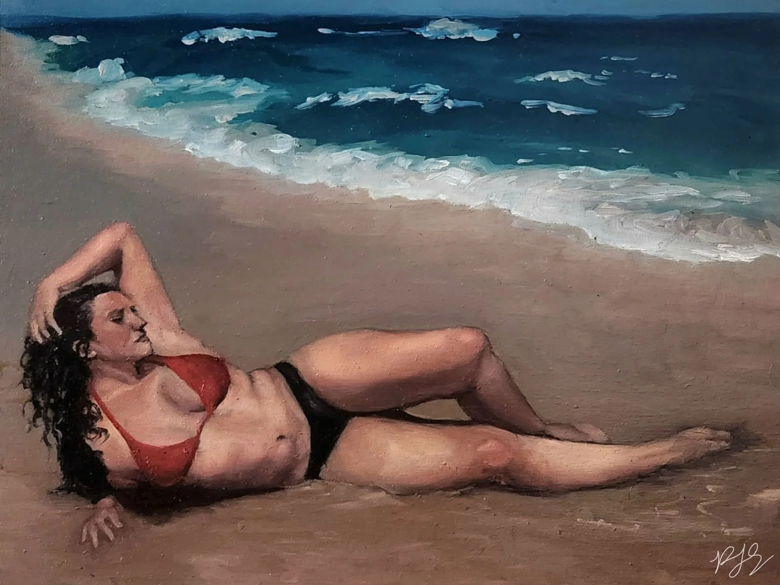 A woman with long dark hair and light skin lying on a sandy beach in a red bikini, relaxing with her eyes closed and arms behind her head, near ocean waves.