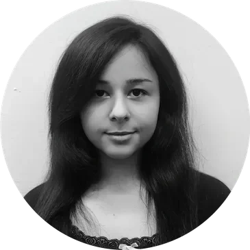 Black and white portrait of a young woman with long, dark hair and a slight smile.