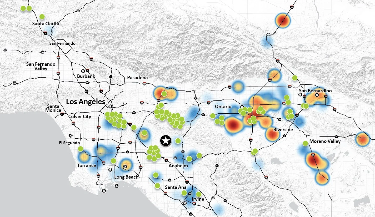A map of Los Angeles and surrounding areas with various colored heat spots and green dots, showing locations of interest or data points.