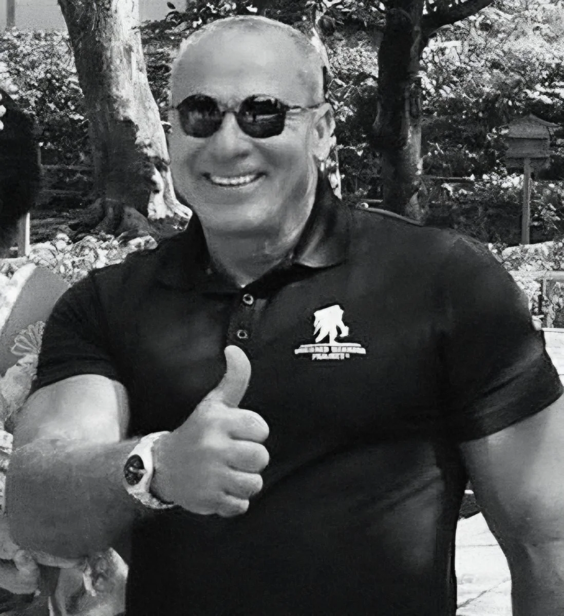Dr. Nabil El-Hag smiling in sunglasses and giving a thumbs-up