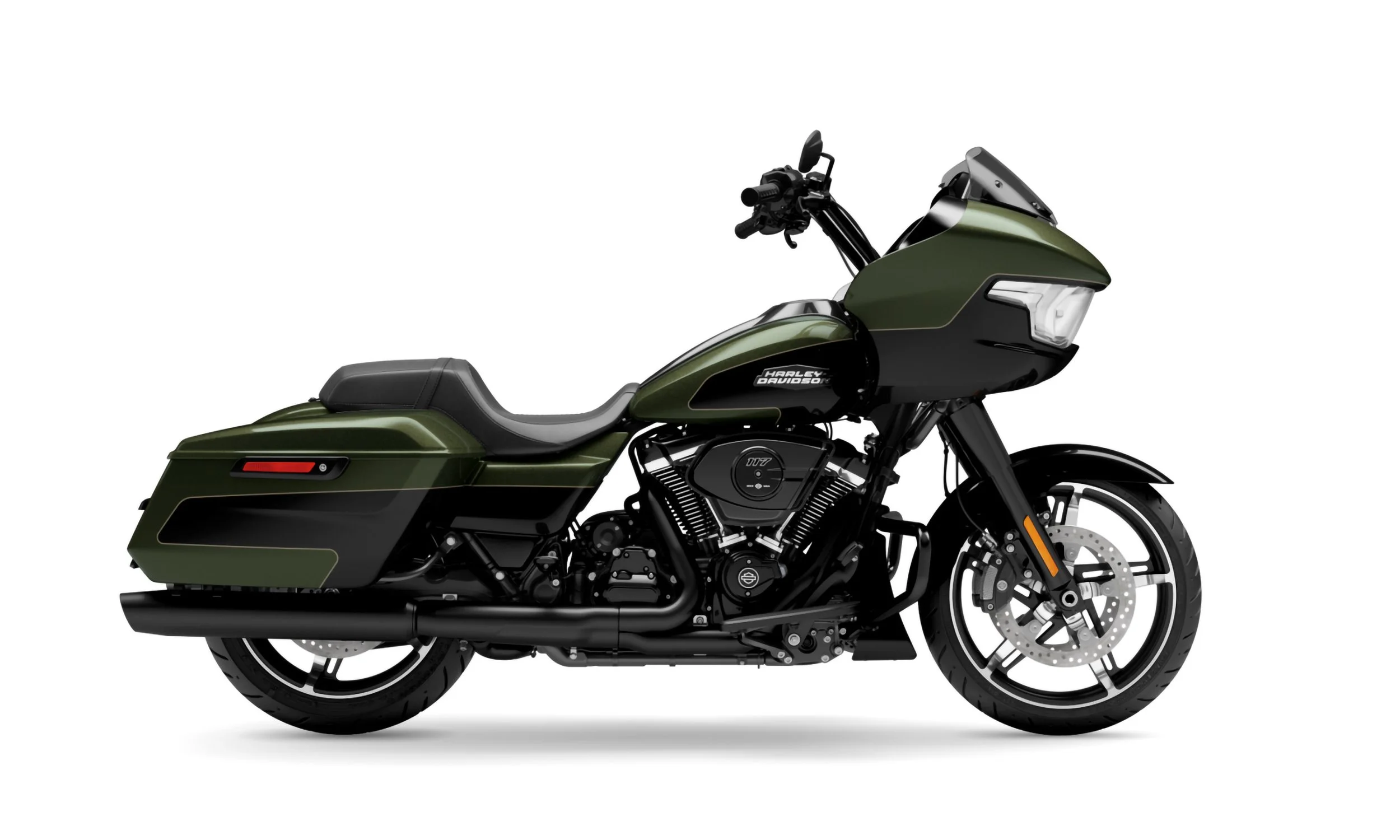 A green Harley Davidson touring motorcycle with black accents, a large windshield, and hard side saddlebags.