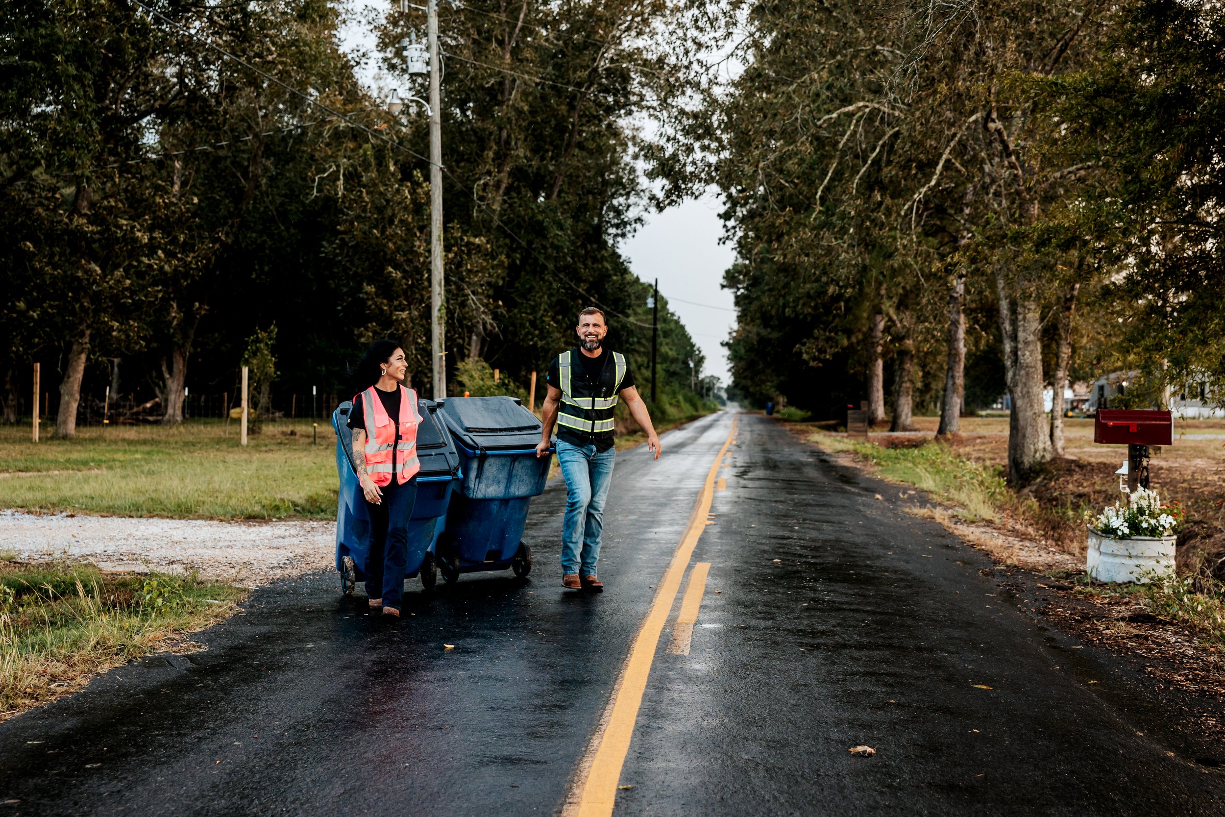 OnlyCans team members walking route with residential carts