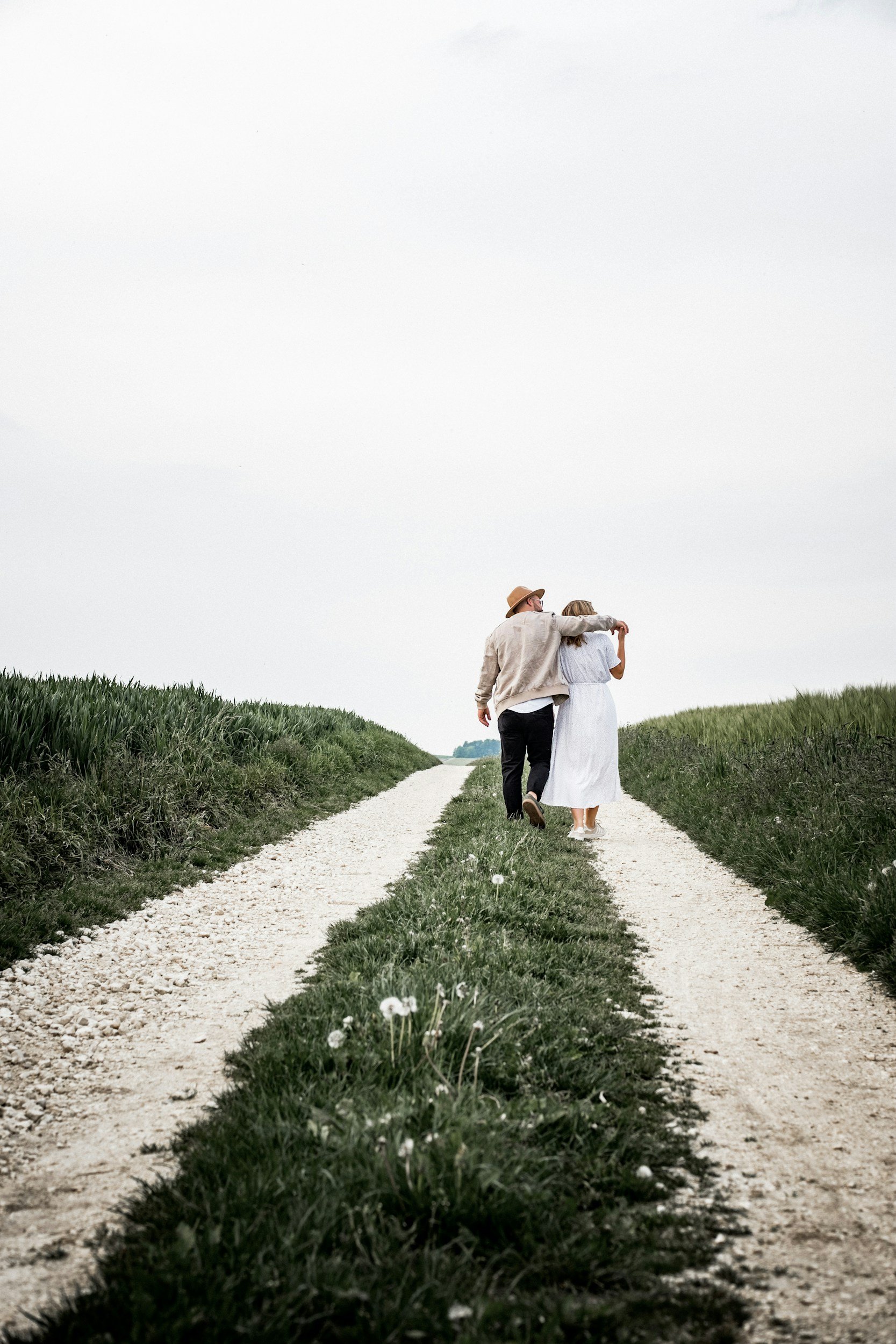 Couple walking together along a path