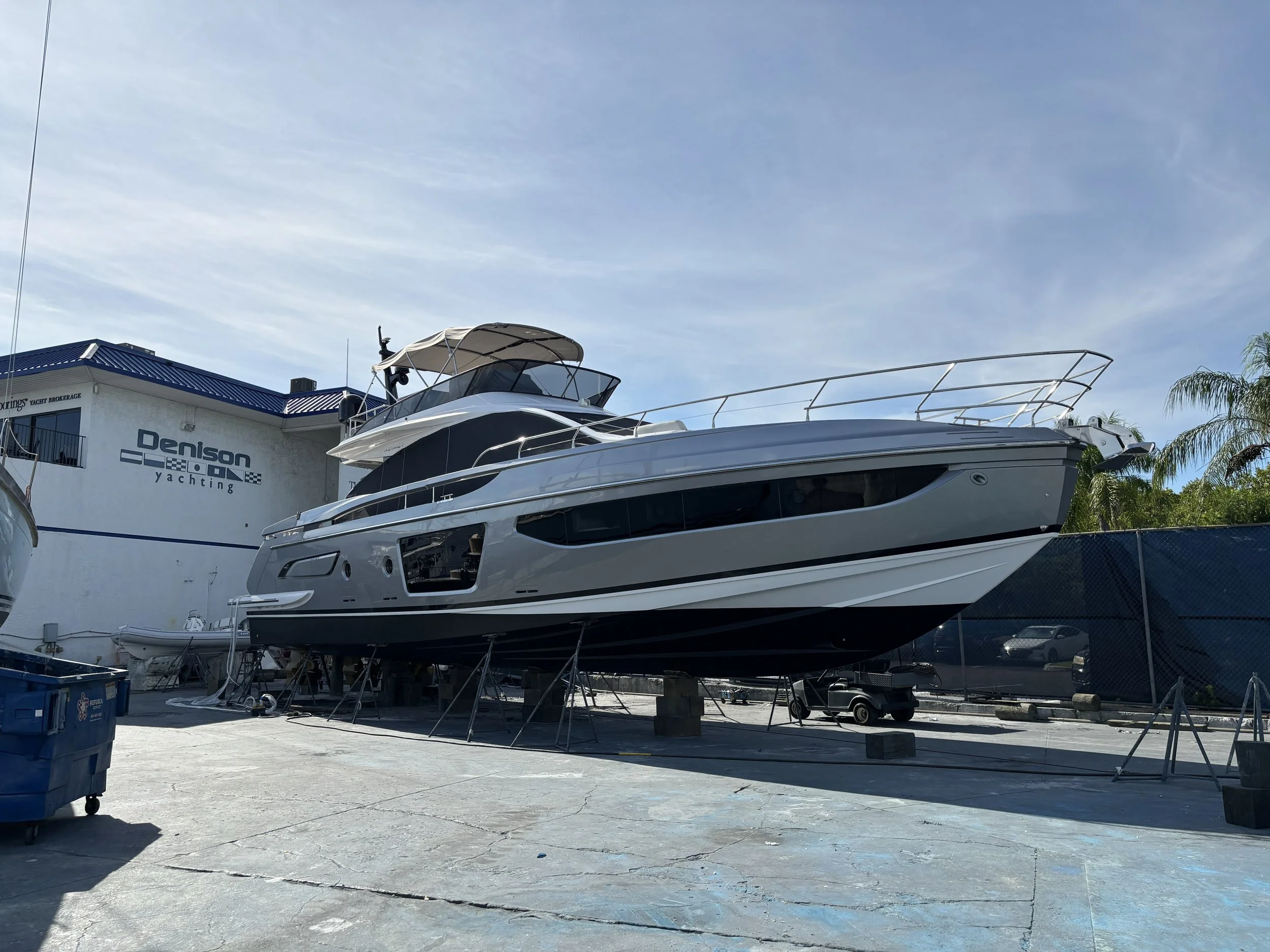 A large yacht on a dry dock or shipyard platform