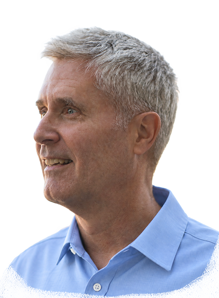 Doug Woodham in three quarter view wearing a light blue button-up shirt.
