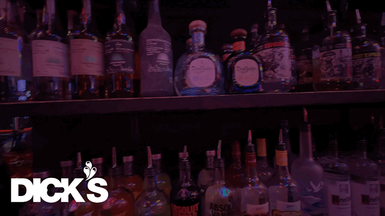Slow Motion Panning Across a Liquor Shelf