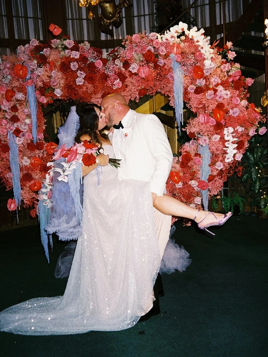 heart-shaped floral arch wedding ceremony at Madonna Inn