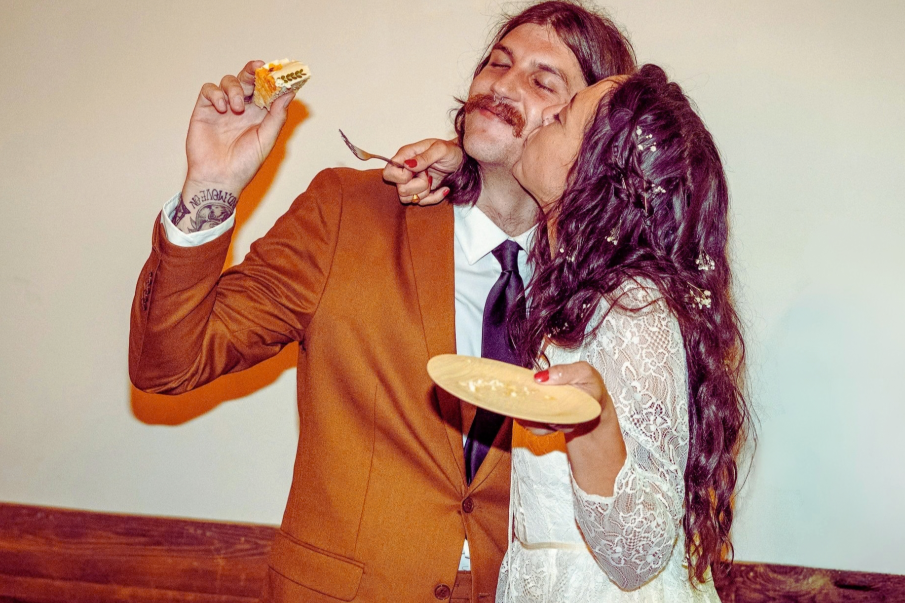 Cake cutting at alternative wedding reception 