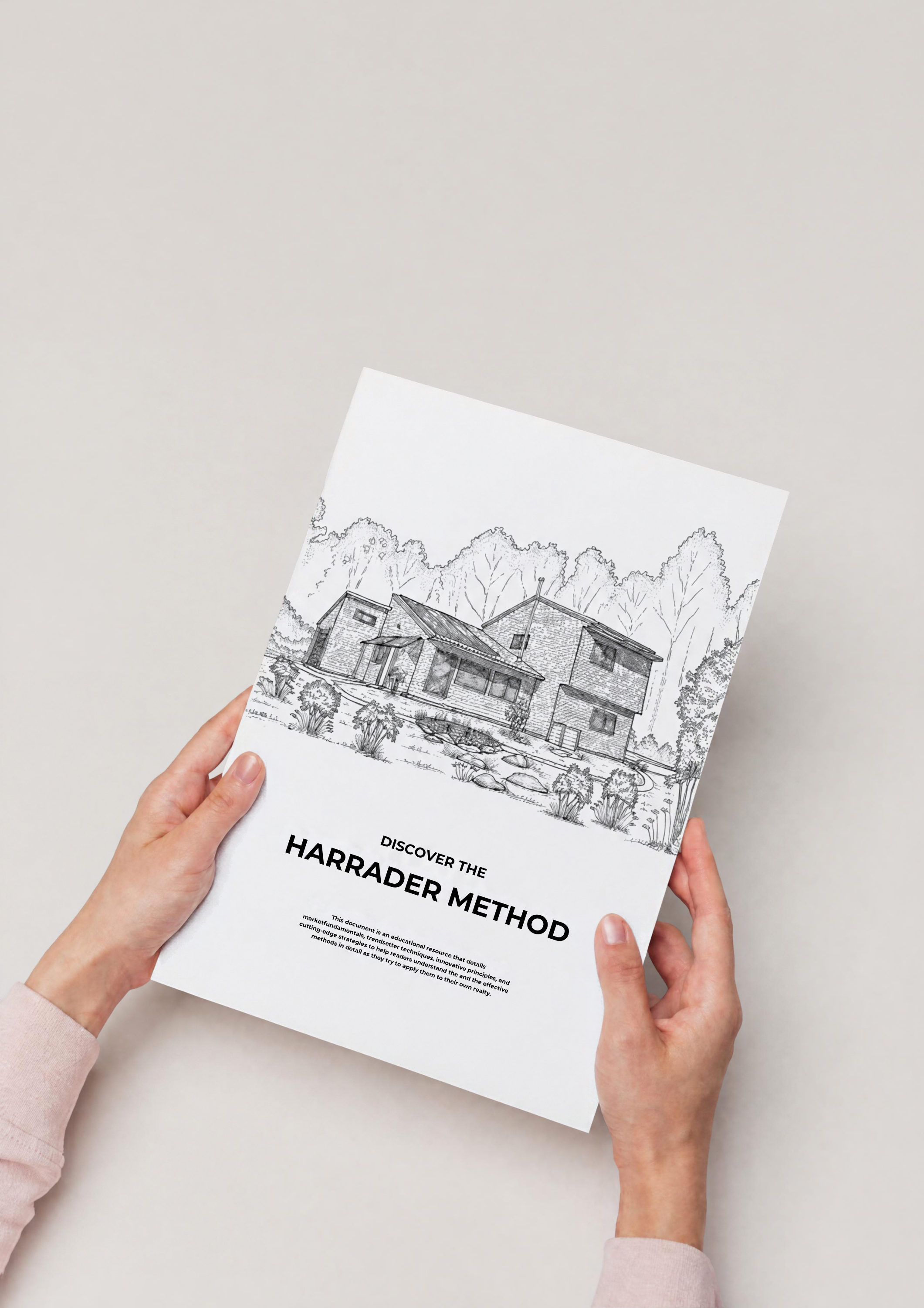 A person holding a booklet titled "Discover the Harrader Method" with a line drawing of a house and trees on the cover, against a plain white background.