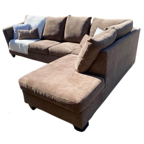 L-shaped beige sectional sofa with multiple cushions and throw pillows.