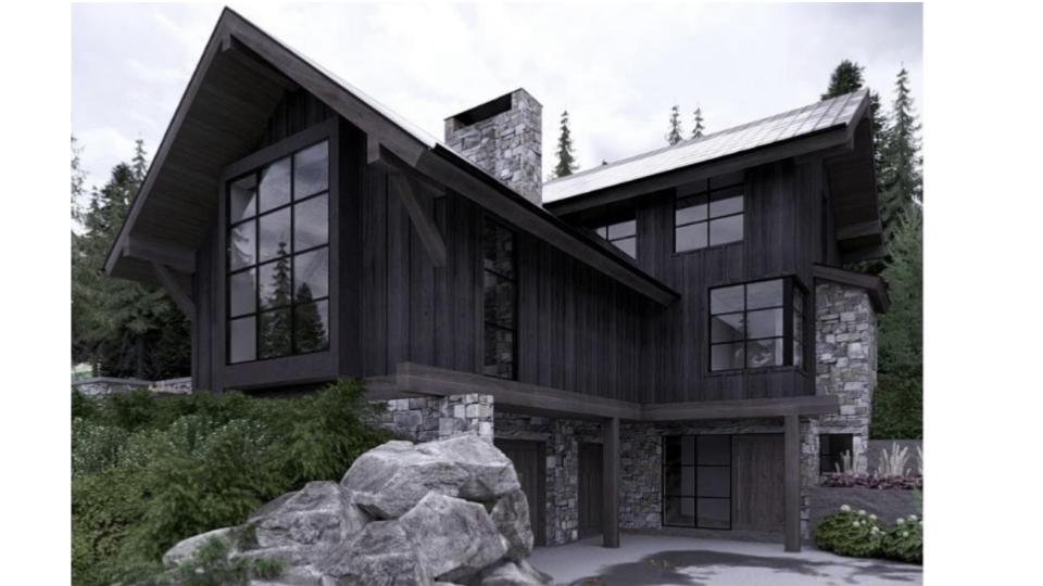 Modern mountain house with black wooden siding, large windows, stone accents, and a sloped roof in a forested area.