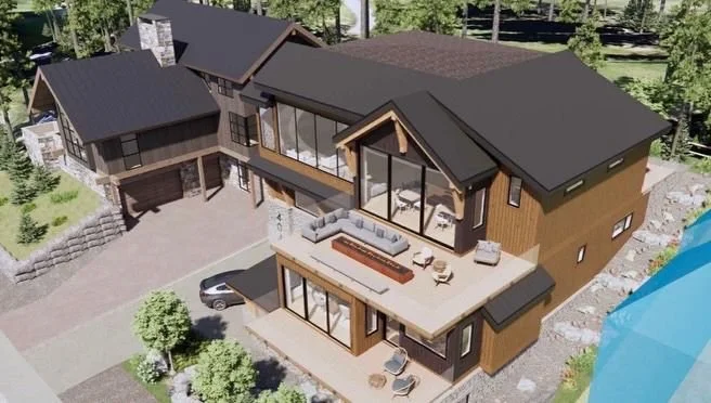 A modern multi-level house with large glass windows, wooden exterior, and expansive outdoor decks, surrounded by trees.