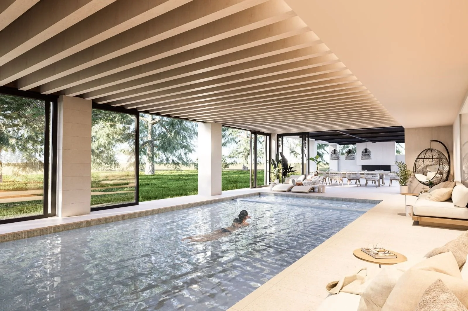 Indoor swimming pool area with large glass windows, lounge chairs, potted plants, and modern decor, with a person swimming in the pool.