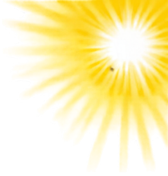 Bright yellow sun with radiating rays against a clear sky.