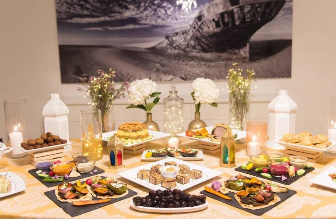 Grazing table with canapé platters and white lanterns