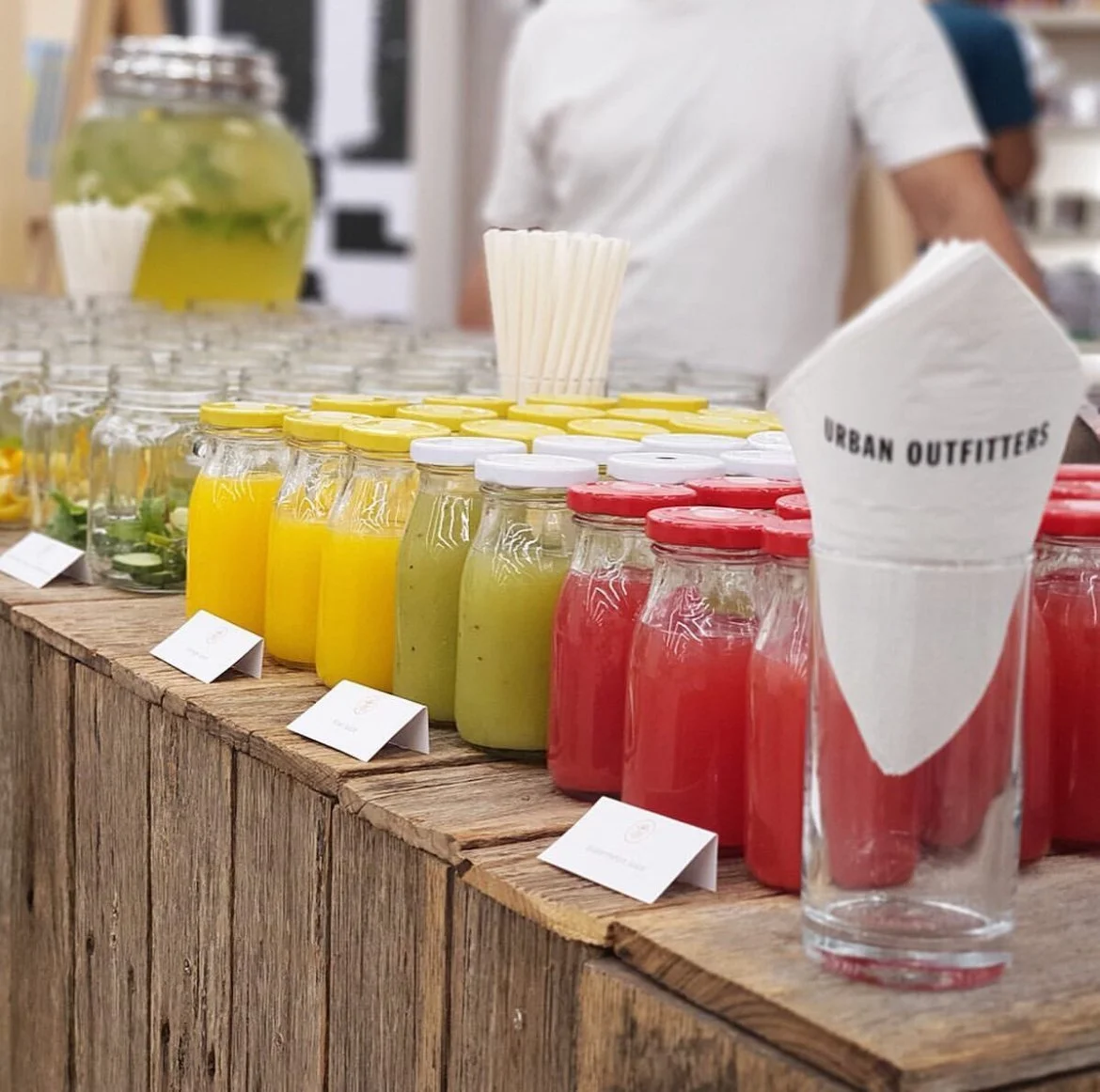 Fresh juices in jars on a rustic wooden bar