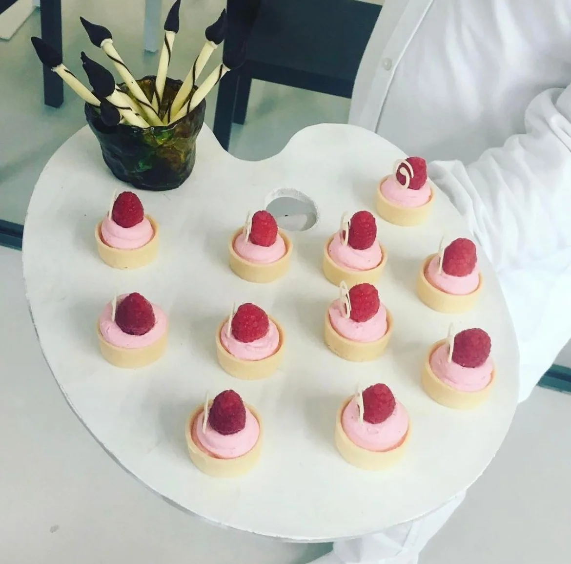 Raspberry tartlets served on an artist's palette