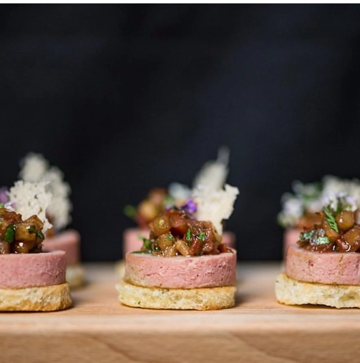 Terrine canapés with chutney and parmesan crisp