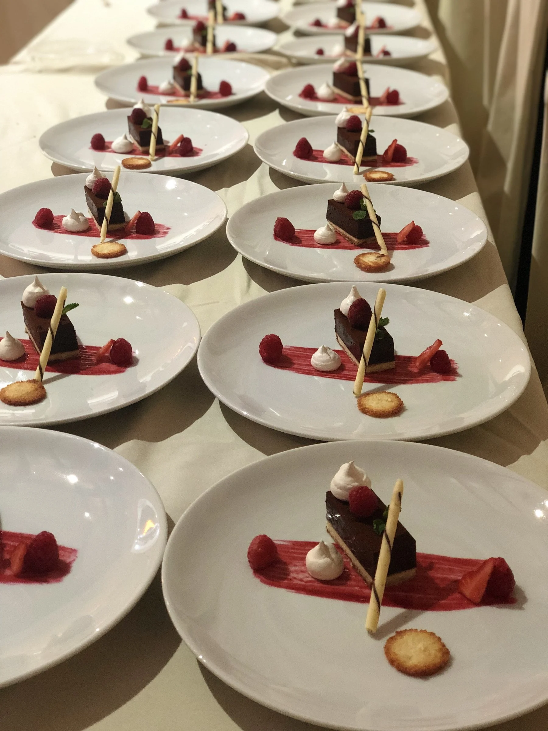 Rows of plated starters with beetroot ready for service
