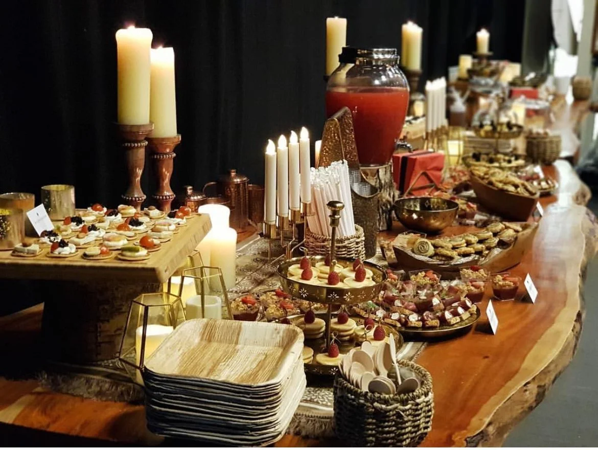 Candlelit grazing table laid out for a corporate event