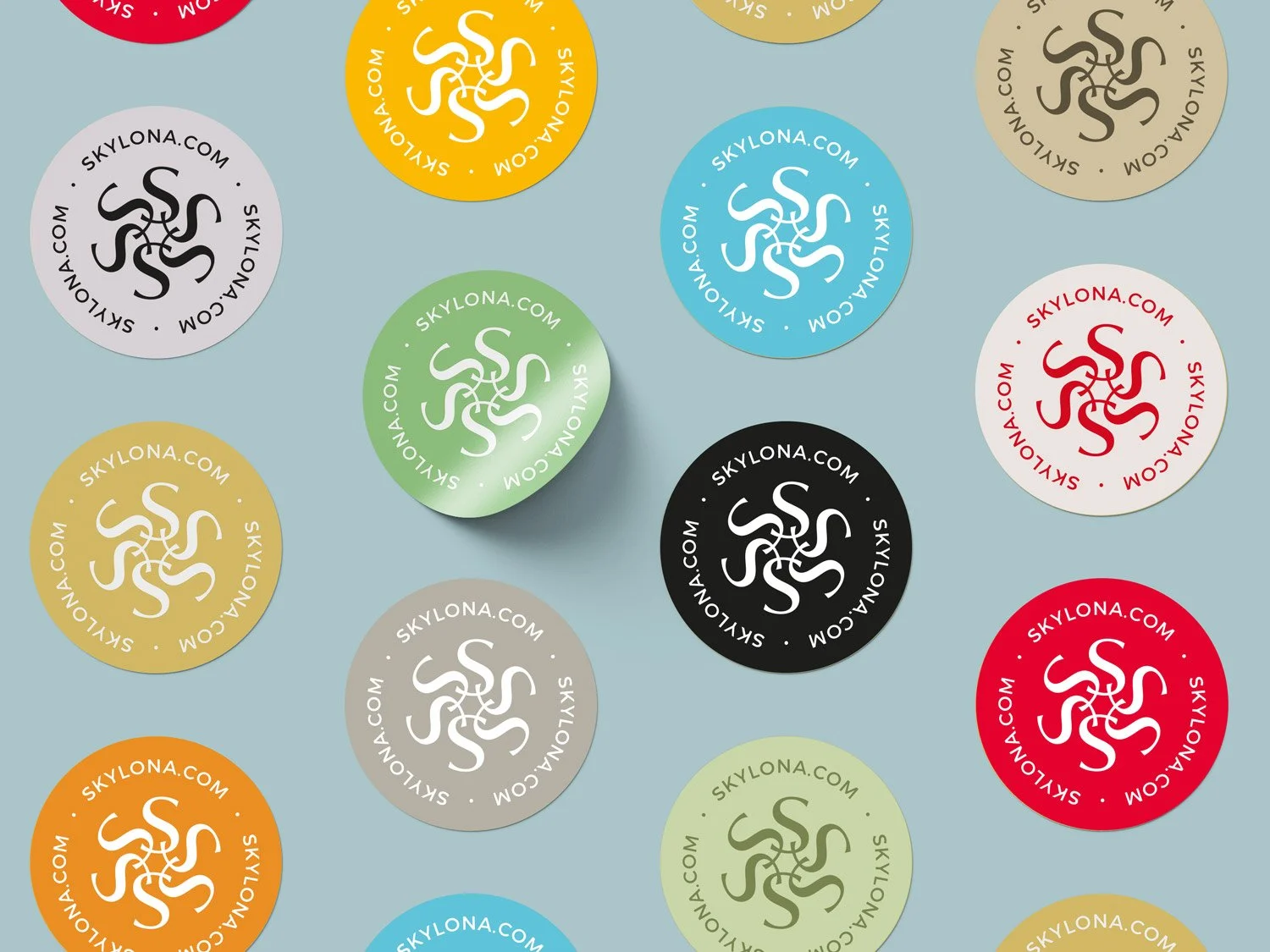 Design of brightly coloured self-adhesive label roundels, used for sealing packaging
