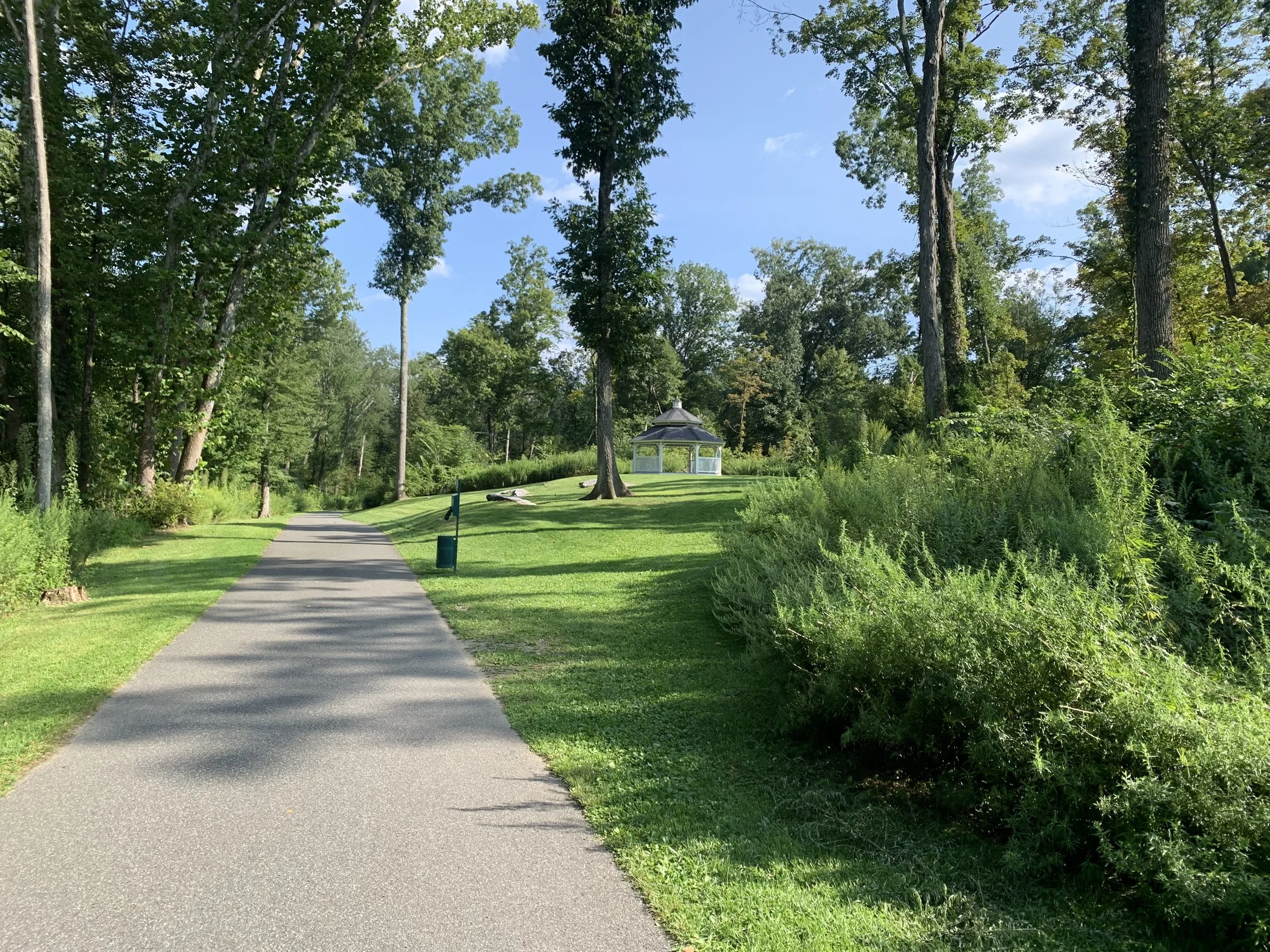 A tree-lined path and gazebo on the Still River Greenway in Brookfield, Connecticut.