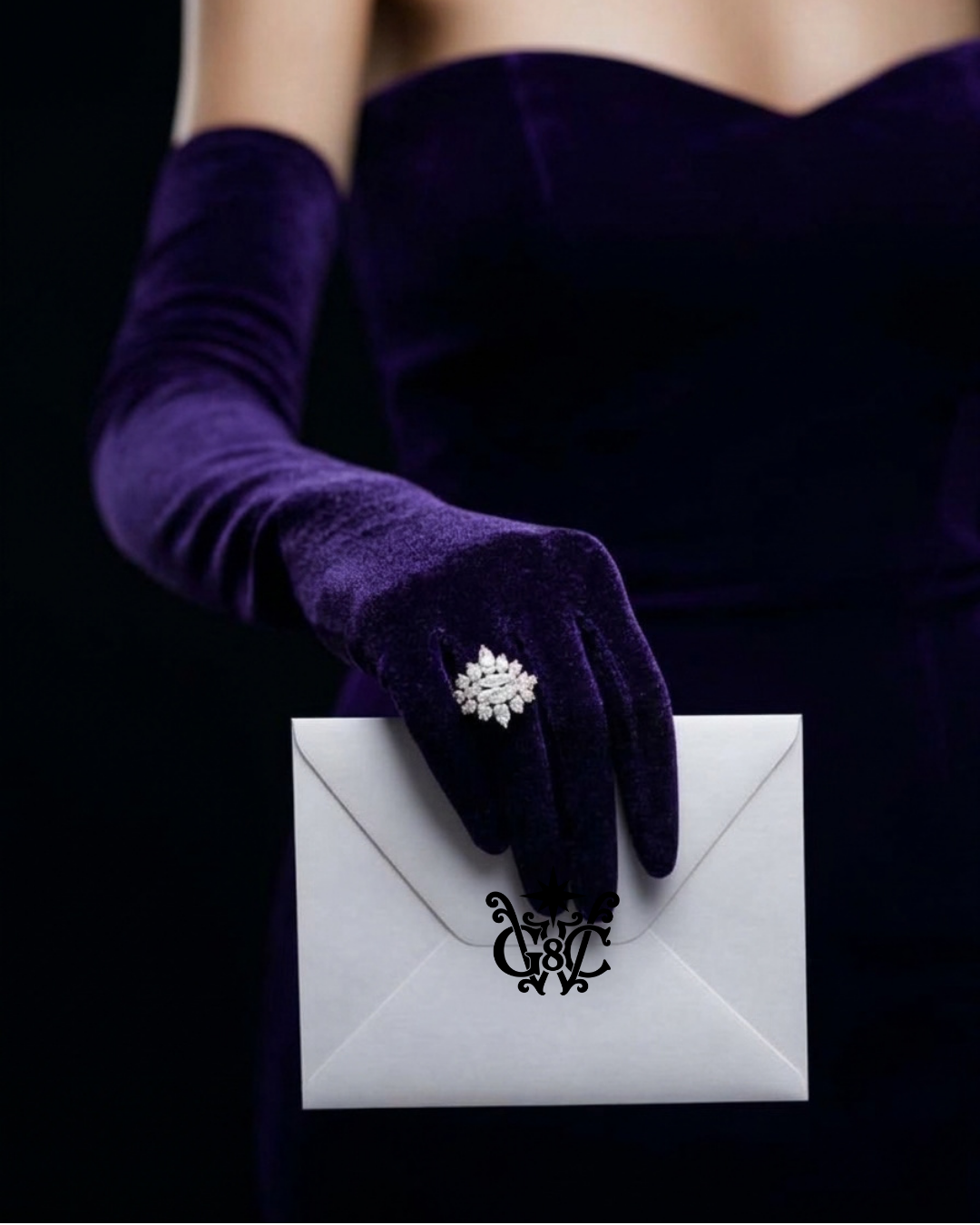 A hand in a long purple velvet glove and sparkling ring holds a white envelope sealed with the Good Woman Circle monogram