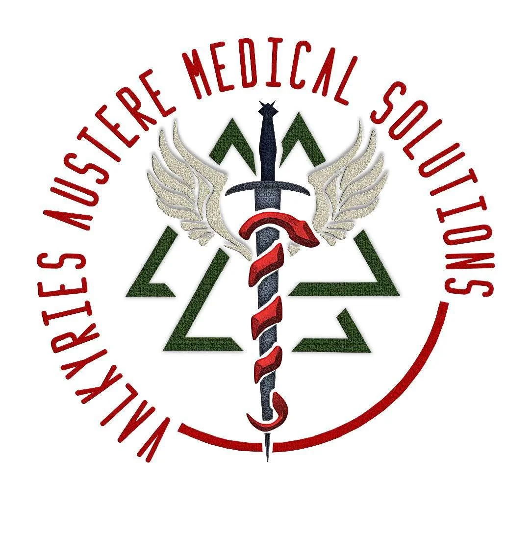 Emblem with the words "WILDERKIES AUSTERE MEDICAL SOLUTIONS" in red circular text surrounding a stylized staff of Asclepius with wings, a crown, and a triangle pattern in green.