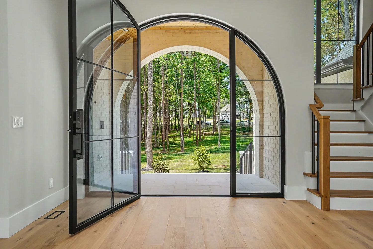 Arched glass entry door