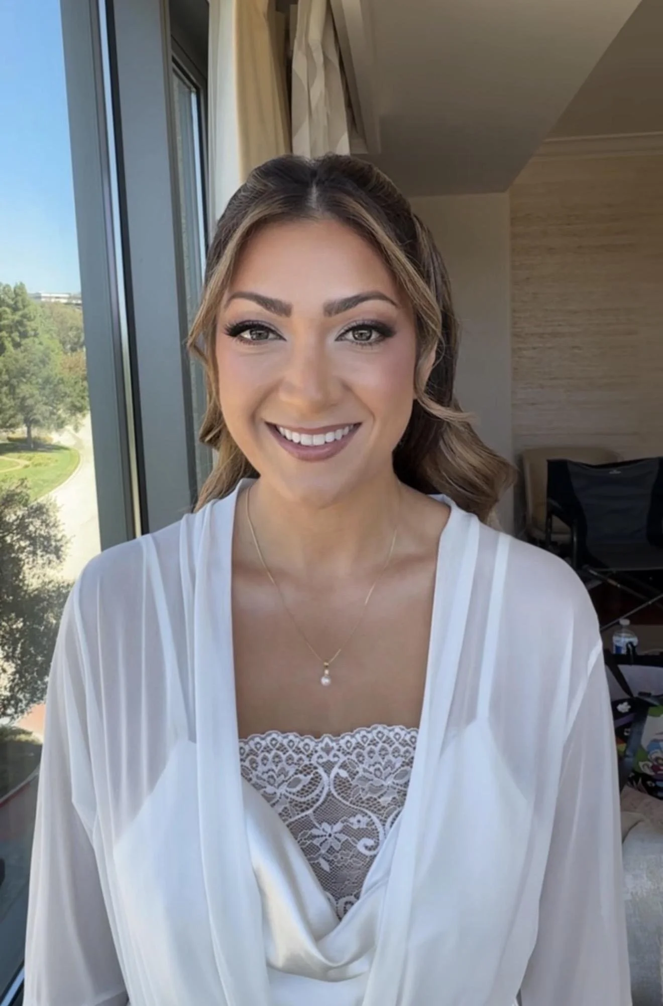 Los Angeles bridal makeup artist Jackie Romero creating soft glam wedding makeup for a bride