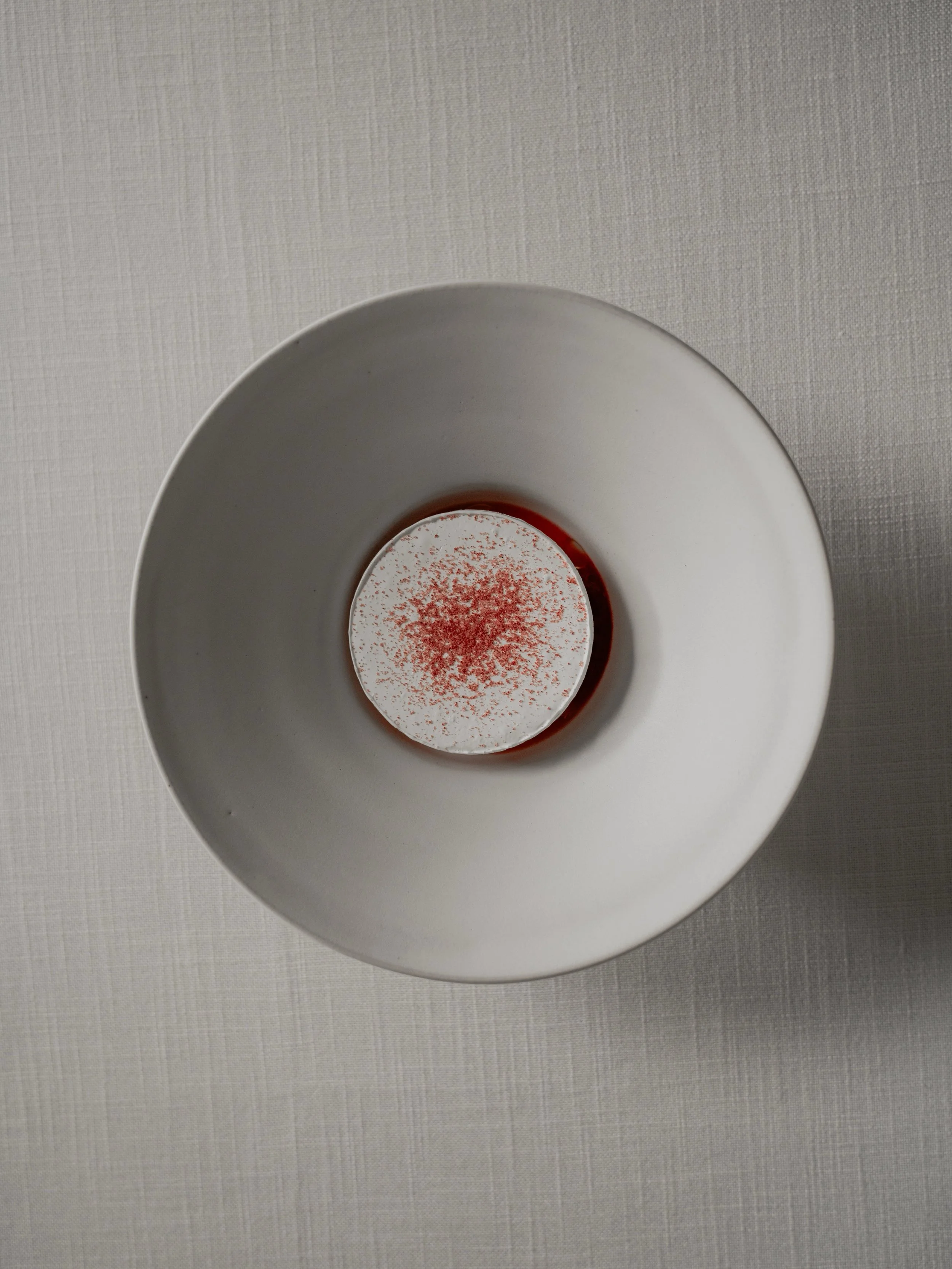 Poached peach, meadowsweet panna cotta, and raspberry granita...

Sun-softened poached peach lies at the core of this dessert, enveloped in a fragrant panna cotta infused with wild meadowsweet. Finished with a crushed raspberry granit&eacute;, it off