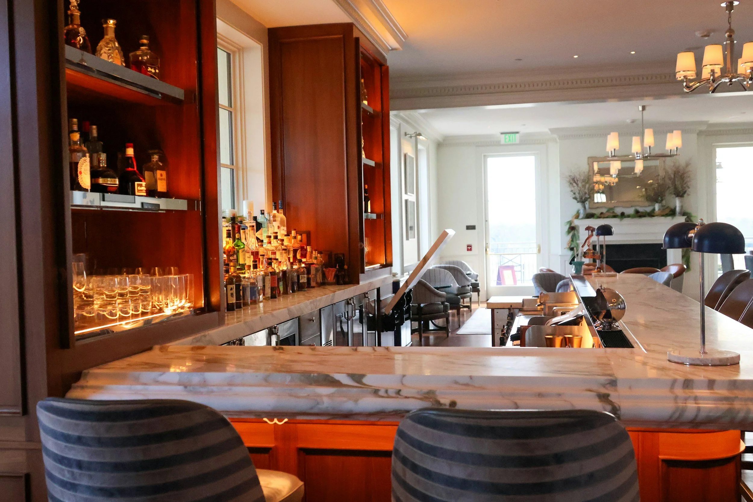 Marble hotel bar with warm lighting, luxury food and beverage