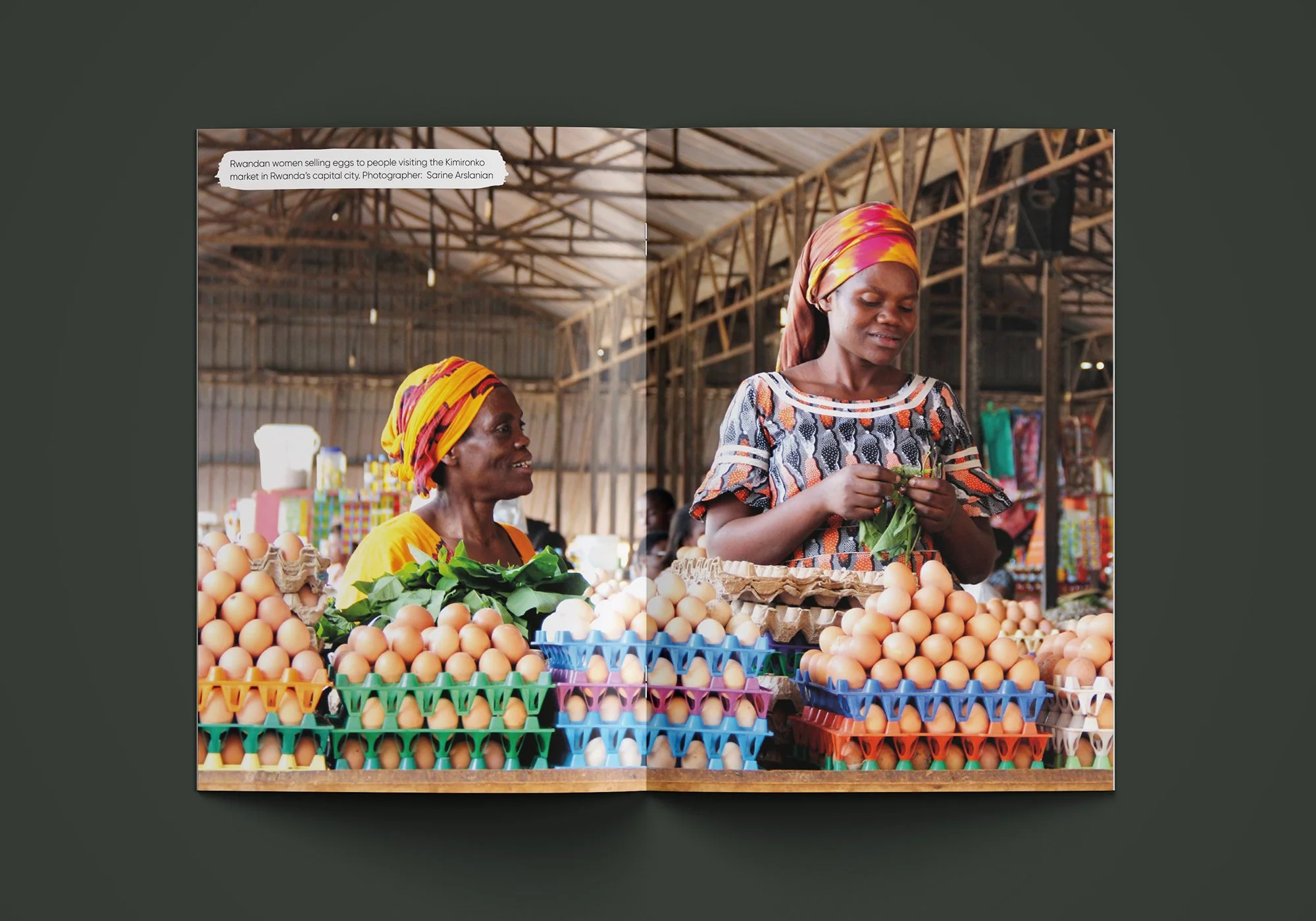 Full-width photograph of two women selling eggs at a market stall