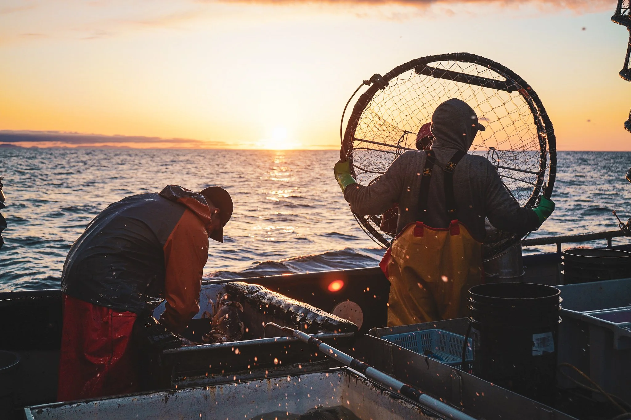 A fisherman at dawn on the Pacific ocean
