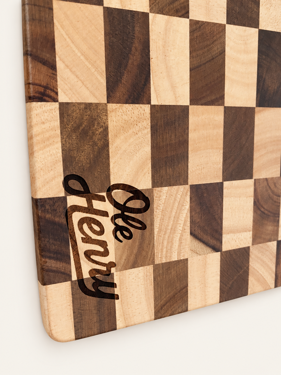 Engraved wooden piece on warm ivory backdrop-5.png