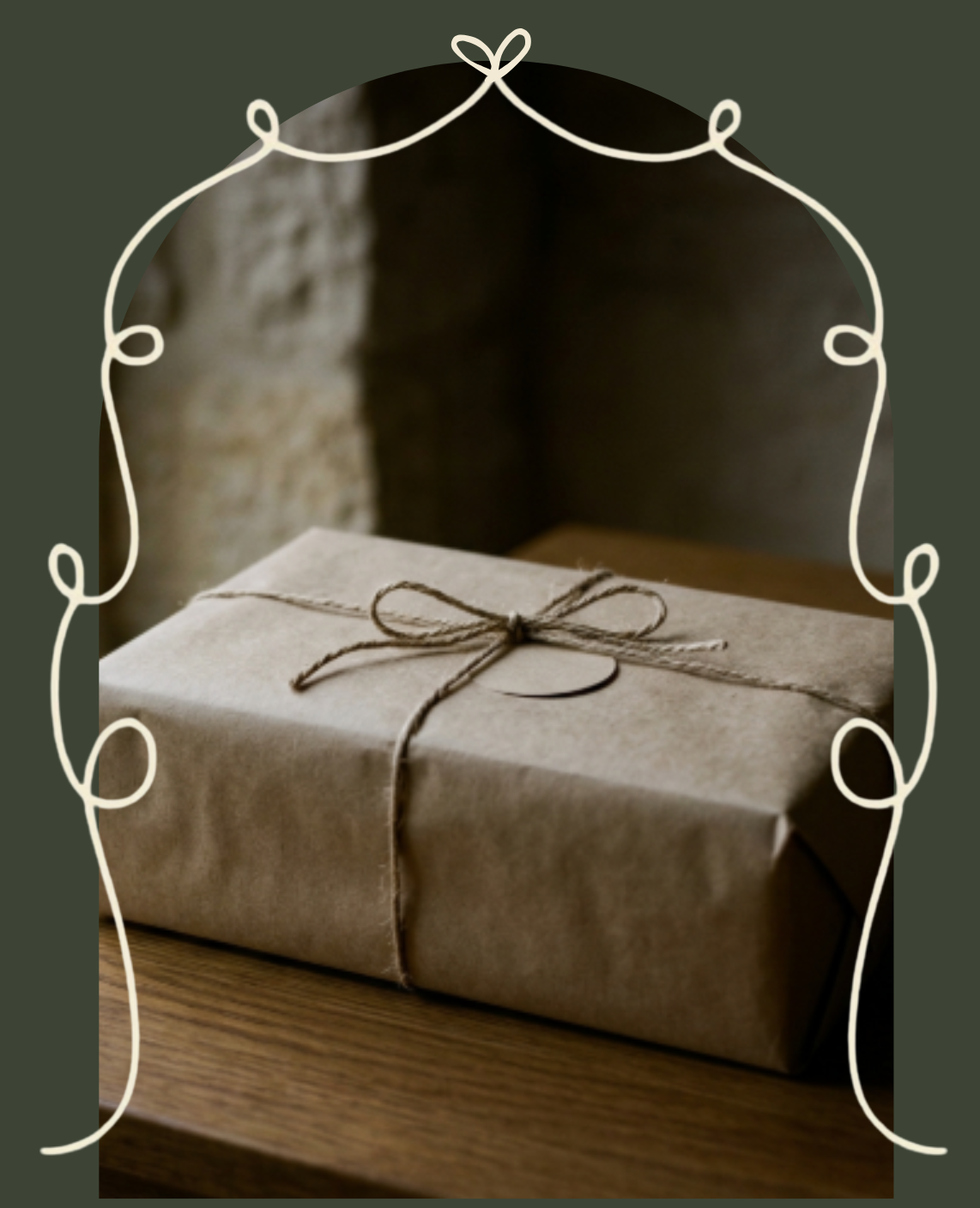 A gift wrapped in brown paper with a twine bow on a wooden surface, with a blurred background and a decorative white border.