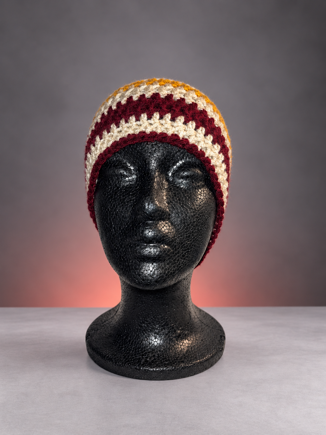 Handmade striped crochet beanie studio portrait-2.png