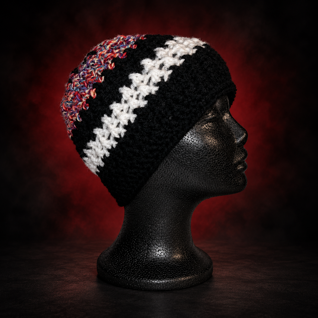 Handmade crochet beanie with black-and-white stripes and flecks of color mixed into the yarn. An everyday fit with its own unique detail. Crafted Different. Worn Bold.