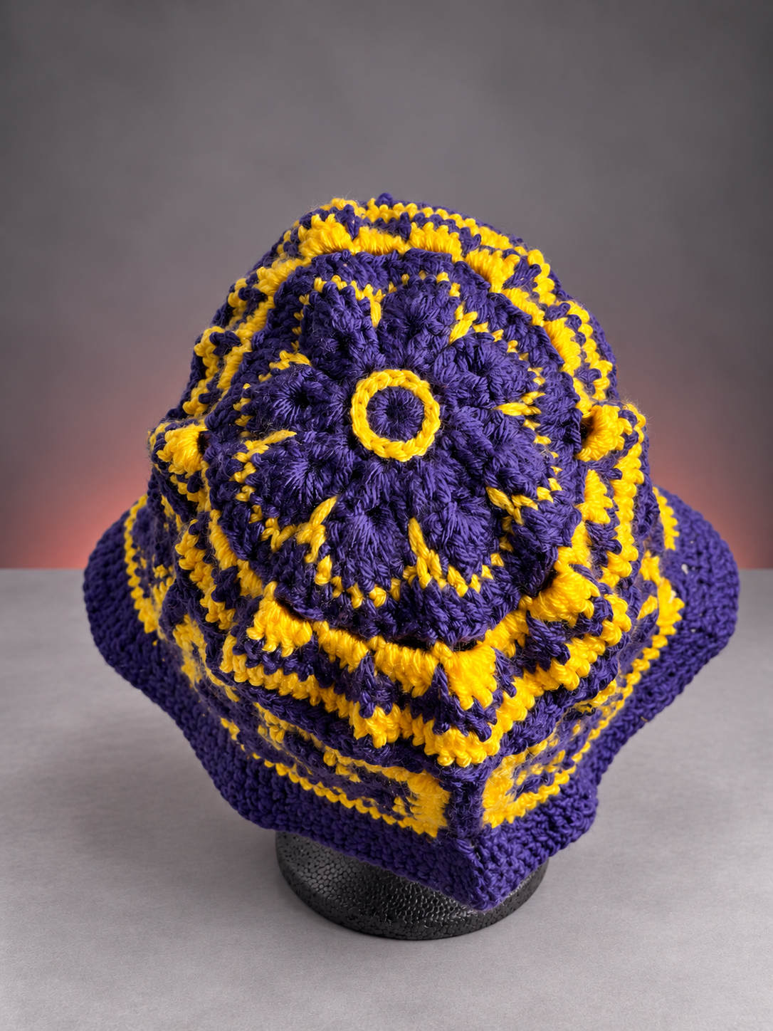 Purple floral crochet hat on gray backdrop-4.png