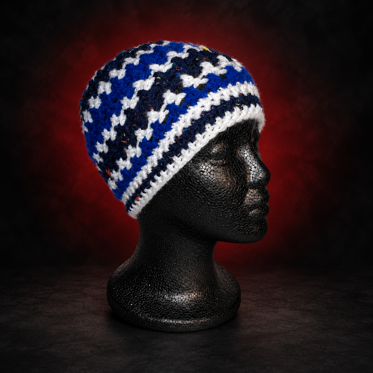 Handmade crochet beanie in blue, white and dark mixed yarn. Bold colors with a classic fit, made to bring something unique to your everyday look. Crafted Different. Worn Bold.