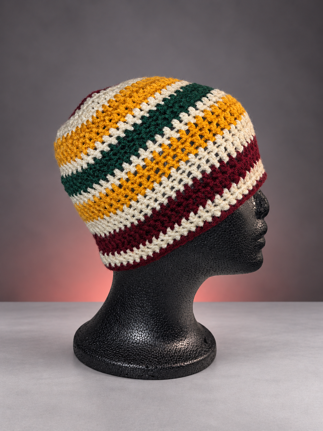Handmade striped crochet beanie on mannequin.png