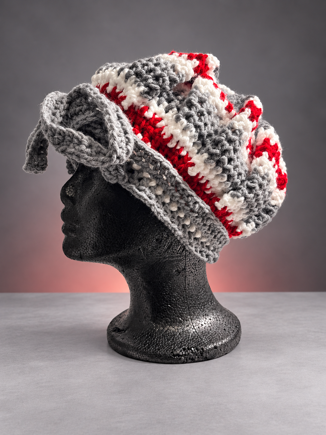 Handmade crochet bonnet on black mannequin-1.png