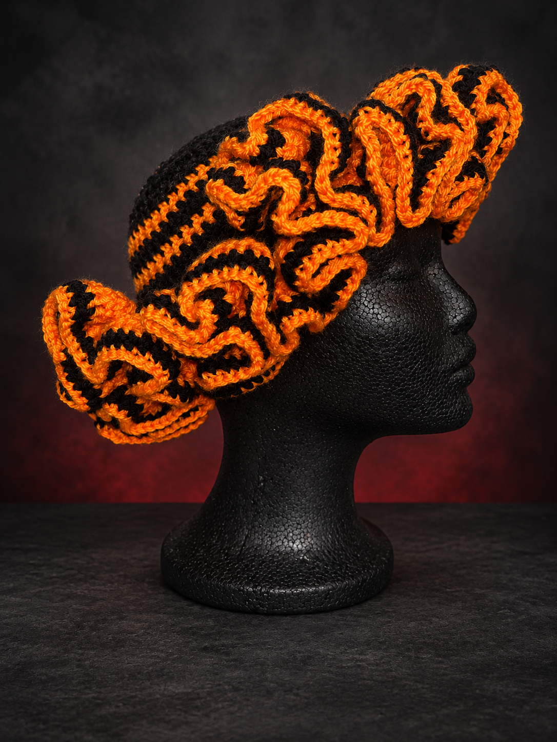 Handmade crochet hat in moody studio.png