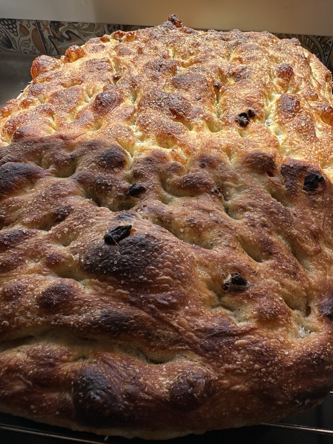 Golden focaccia with a blistered crust